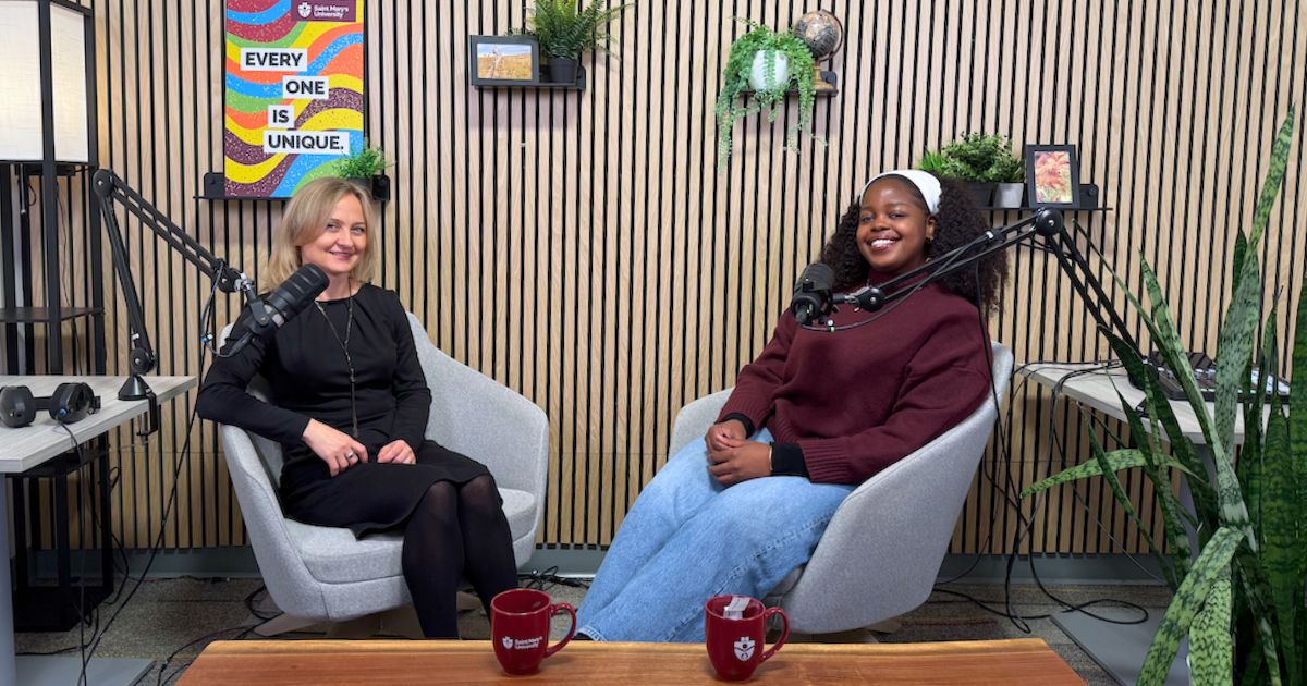 A professor and student sit together at SMU's podcast studio