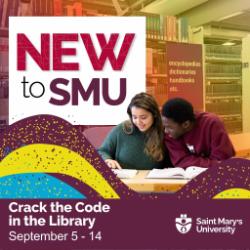 Two students looking at a book